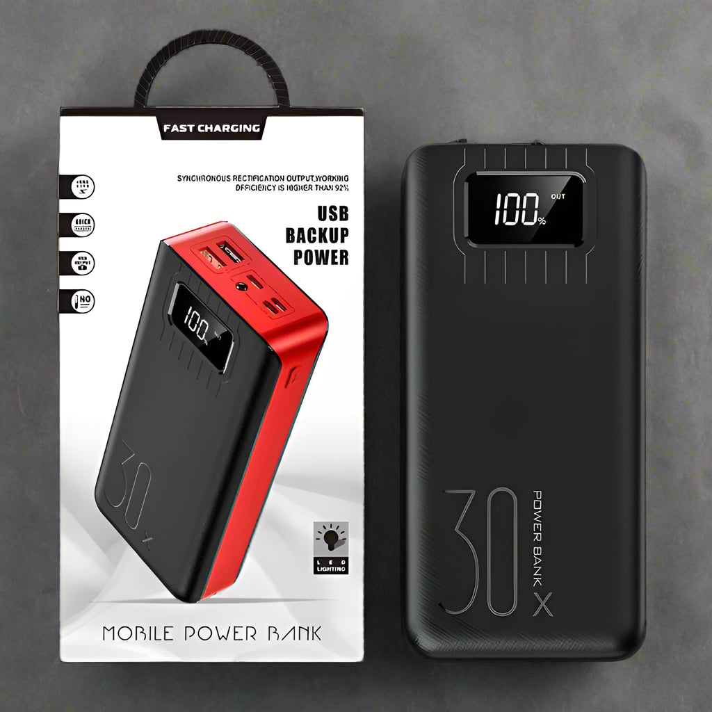 Black and red power bank with digital display and packaging on a white background